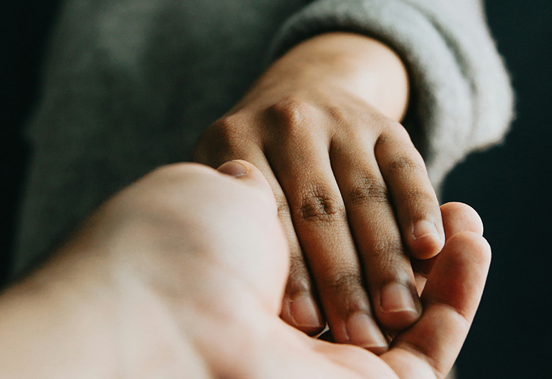 ave-calvar-IC6rP1T82pE-unsplash copy Black and white caring hands
